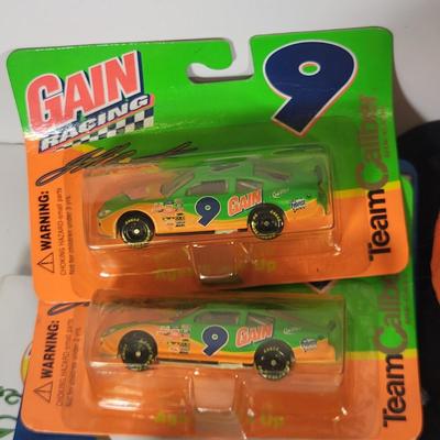 LOT 96: Nascar Memorabilia Lot Including Autographed Geico T-shirt, Toy Replicas and More