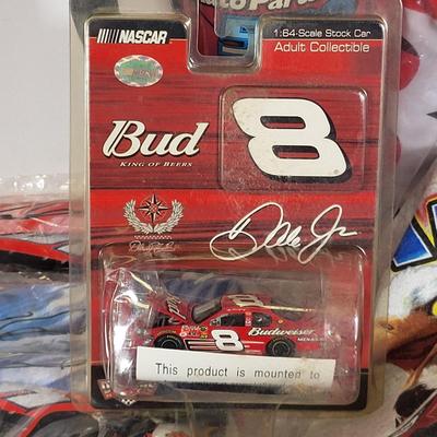 LOT 97: Nascar Memorabilia Lot Featuring Sponsor Hats, Dale Earnhardt Jr Toy Car 1:64 Replica and More