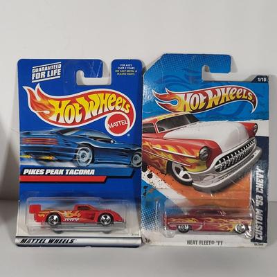 LOT 100: Eight Vintage Hot Wheels Lot Featuring 59' Impala, Santa Clause Rodger Dodger and More