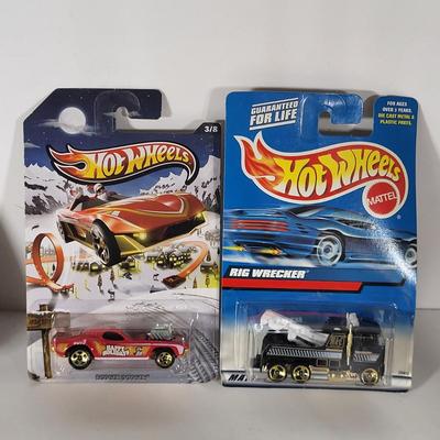 LOT 100: Eight Vintage Hot Wheels Lot Featuring 59' Impala, Santa Clause Rodger Dodger and More