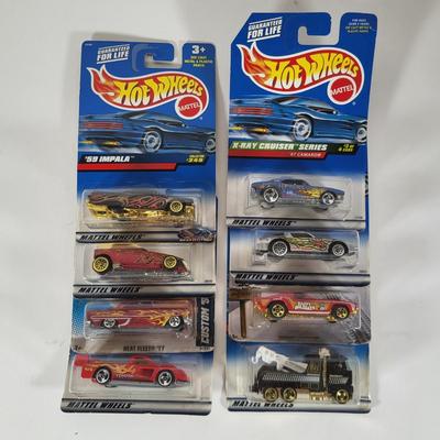 LOT 100: Eight Vintage Hot Wheels Lot Featuring 59' Impala, Santa Clause Rodger Dodger and More