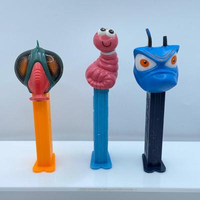 LOT 132: Pez Dispenser Collection: Funny Fruit, Bugs, Worm & More