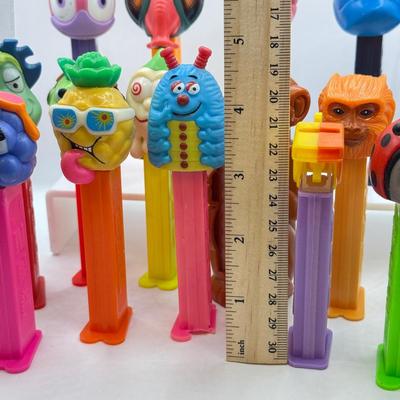 LOT 132: Pez Dispenser Collection: Funny Fruit, Bugs, Worm & More