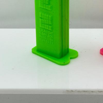 LOT 132: Pez Dispenser Collection: Funny Fruit, Bugs, Worm & More