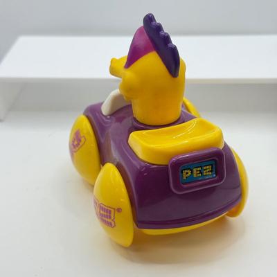 LOT 135: PEZ Collection: Flashlight, Toy Car, Monster Head Dispensers