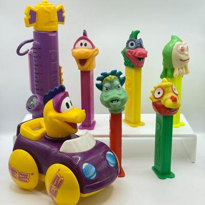 LOT 135: PEZ Collection: Flashlight, Toy Car, Monster Head Dispensers