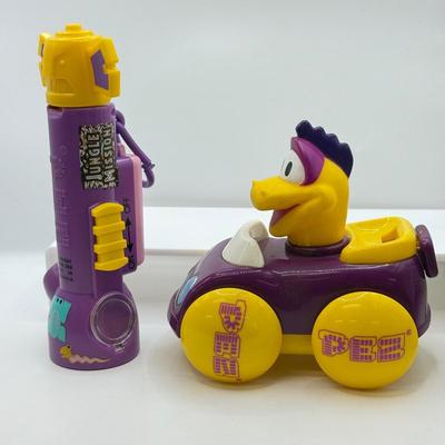 LOT 135: PEZ Collection: Flashlight, Toy Car, Monster Head Dispensers