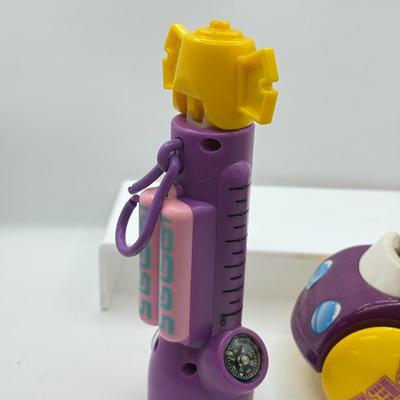 LOT 135: PEZ Collection: Flashlight, Toy Car, Monster Head Dispensers