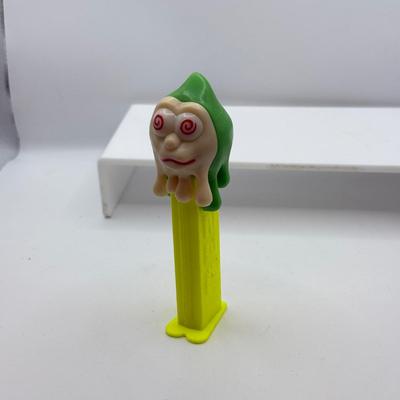 LOT 135: PEZ Collection: Flashlight, Toy Car, Monster Head Dispensers