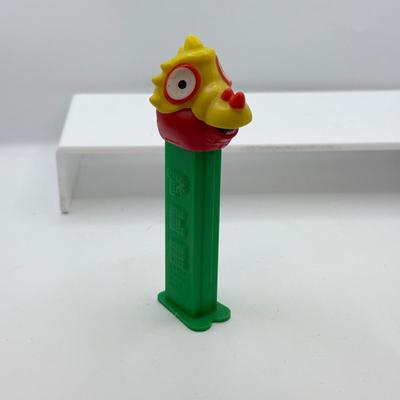 LOT 135: PEZ Collection: Flashlight, Toy Car, Monster Head Dispensers