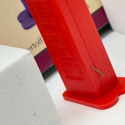 LOT 136: Pez Collector's Books & Dispensers from Simpsons & Bee Movie