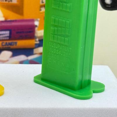 LOT 136: Pez Collector's Books & Dispensers from Simpsons & Bee Movie