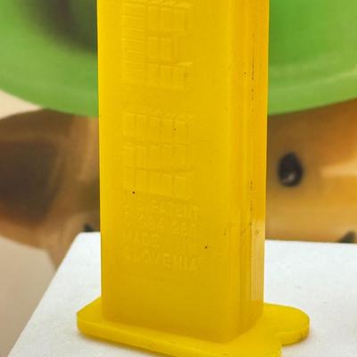 LOT 136: Pez Collector's Books & Dispensers from Simpsons & Bee Movie