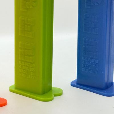 LOT 136: Pez Collector's Books & Dispensers from Simpsons & Bee Movie