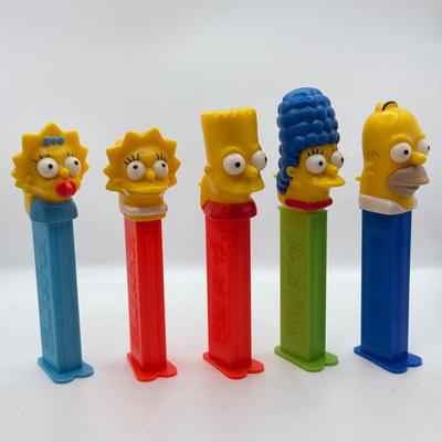 LOT 136: Pez Collector's Books & Dispensers from Simpsons & Bee Movie