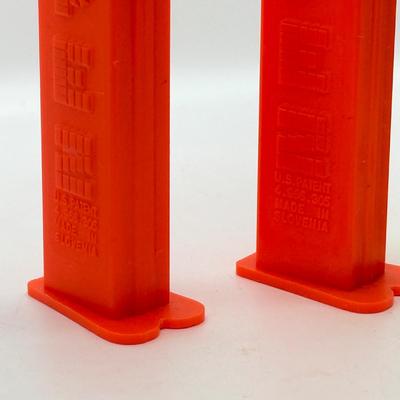 LOT 136: Pez Collector's Books & Dispensers from Simpsons & Bee Movie
