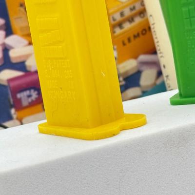 LOT 136: Pez Collector's Books & Dispensers from Simpsons & Bee Movie