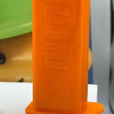 LOT 136: Pez Collector's Books & Dispensers from Simpsons & Bee Movie