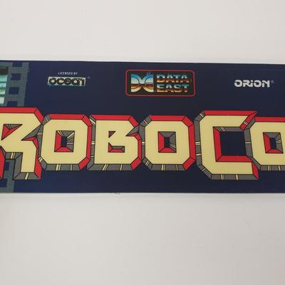 LOT 150: Robocop Glass Arcade Marquee, 2 Sonic Sega Games, Vintage Laser Gun