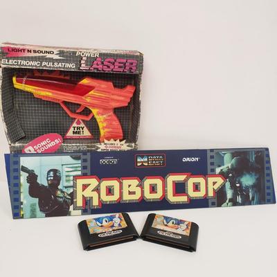 LOT 150: Robocop Glass Arcade Marquee, 2 Sonic Sega Games, Vintage Laser Gun