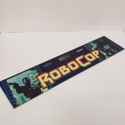 LOT 150: Robocop Glass Arcade Marquee, 2 Sonic Sega Games, Vintage Laser Gun
