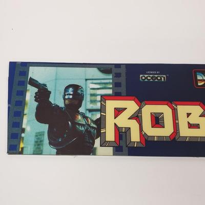 LOT 150: Robocop Glass Arcade Marquee, 2 Sonic Sega Games, Vintage Laser Gun