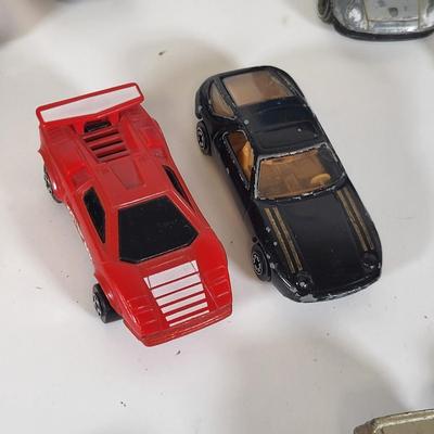 LOT 160: Vintage Toy Car and Carrying Case by Various Toy Manufacturers