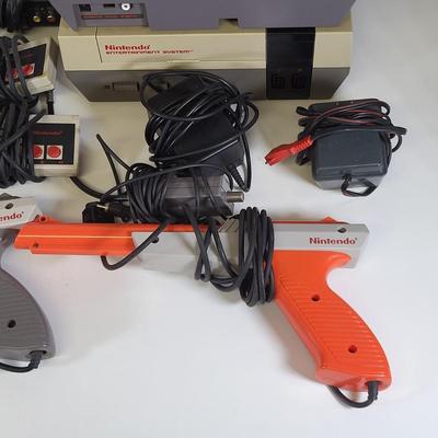 LOT 163: Two Original Vintage Nintendo NES Systems with Controllers, Duck Hunt Guns and More