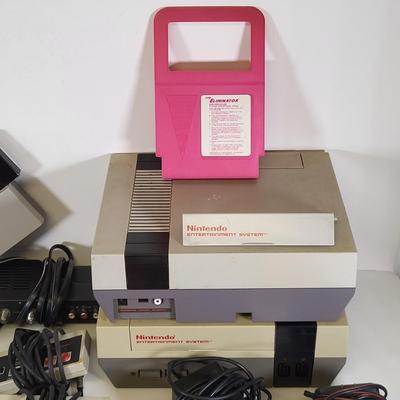 LOT 163: Two Original Vintage Nintendo NES Systems with Controllers, Duck Hunt Guns and More