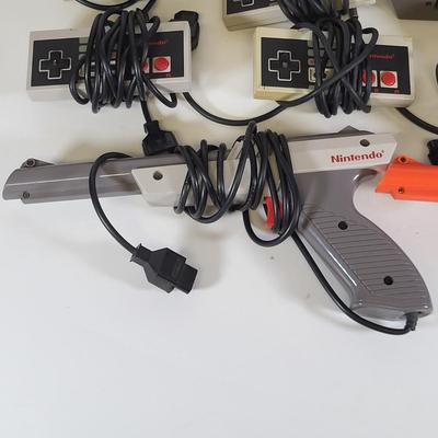 LOT 163: Two Original Vintage Nintendo NES Systems with Controllers, Duck Hunt Guns and More