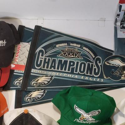 LOT 165: Philadelphia Sports Memorabilia Including Autographed Hats of Jon Runyan, Brian Propp and More