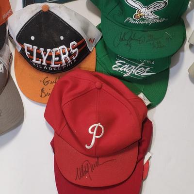 LOT 165: Philadelphia Sports Memorabilia Including Autographed Hats of Jon Runyan, Brian Propp and More