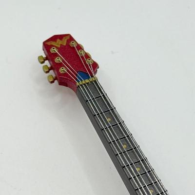 LOT 171: Hallmark Keepsake Guitar Magic Ornaments in Boxes: Wonder Woman Rocks & Batman Rocks
