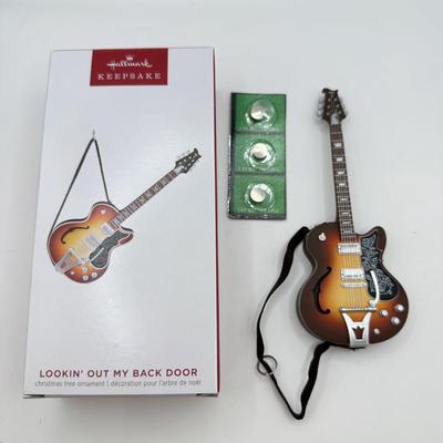 LOT 172: Hallmark Keepsake Guitar Ornaments in Boxes: 2023 Lookin' Out My Back Door & 2019 Rockin' Guitar