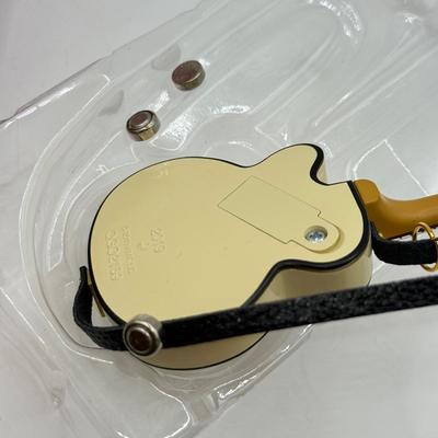 LOT 172: Hallmark Keepsake Guitar Ornaments in Boxes: 2023 Lookin' Out My Back Door & 2019 Rockin' Guitar