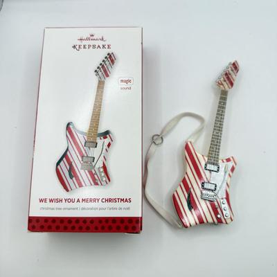 LOT 175: Hallmark Keepsake Magic Guitar Ornaments in Boxes: We Wish You a Merry Christmas & Santa Claus is Comin' to Town