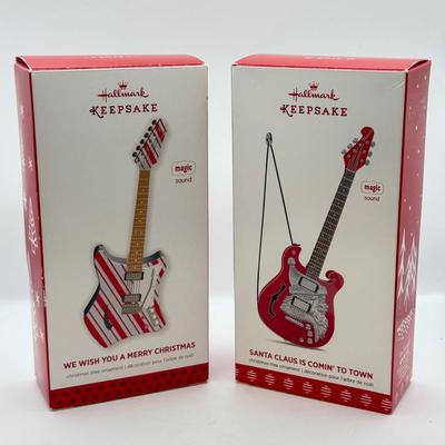 LOT 175: Hallmark Keepsake Magic Guitar Ornaments in Boxes: We Wish You a Merry Christmas & Santa Claus is Comin' to Town