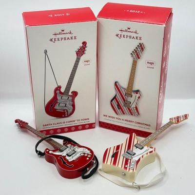 LOT 175: Hallmark Keepsake Magic Guitar Ornaments in Boxes: We Wish You a Merry Christmas & Santa Claus is Comin' to Town