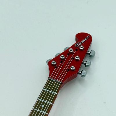 LOT 175: Hallmark Keepsake Magic Guitar Ornaments in Boxes: We Wish You a Merry Christmas & Santa Claus is Comin' to Town