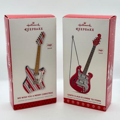 LOT 175: Hallmark Keepsake Magic Guitar Ornaments in Boxes: We Wish You a Merry Christmas & Santa Claus is Comin' to Town