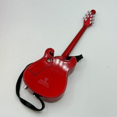 LOT 175: Hallmark Keepsake Magic Guitar Ornaments in Boxes: We Wish You a Merry Christmas & Santa Claus is Comin' to Town