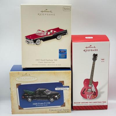 LOT 176: Hallmark Keepsake Ornaments in Boxes: Magic Guitar Rockin' Around the Christmas Tree, 1957 Ford Fairlane 500 & 2000...