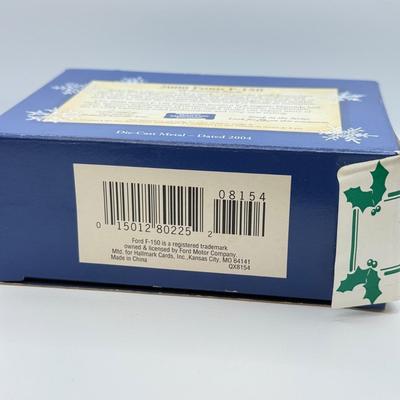 LOT 176: Hallmark Keepsake Ornaments in Boxes: Magic Guitar Rockin' Around the Christmas Tree, 1957 Ford Fairlane 500 & 2000...
