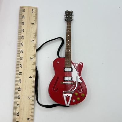 LOT 176: Hallmark Keepsake Ornaments in Boxes: Magic Guitar Rockin' Around the Christmas Tree, 1957 Ford Fairlane 500 & 2000...