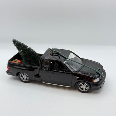 LOT 176: Hallmark Keepsake Ornaments in Boxes: Magic Guitar Rockin' Around the Christmas Tree, 1957 Ford Fairlane 500 & 2000...