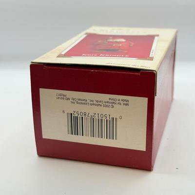 LOT 178: Lenox Fishing Santa, Hallmark Keepsake Ornament Kris Kringle & Trio of Santas all in Boxes