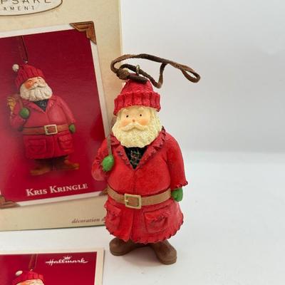LOT 178: Lenox Fishing Santa, Hallmark Keepsake Ornament Kris Kringle & Trio of Santas all in Boxes