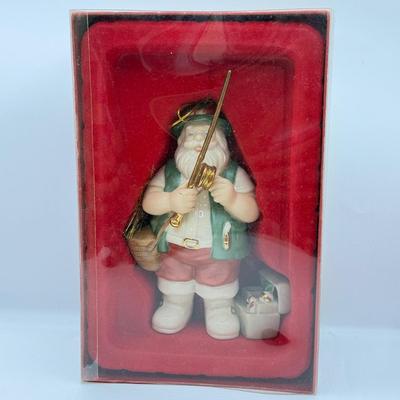 LOT 178: Lenox Fishing Santa, Hallmark Keepsake Ornament Kris Kringle & Trio of Santas all in Boxes