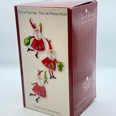 LOT 178: Lenox Fishing Santa, Hallmark Keepsake Ornament Kris Kringle & Trio of Santas all in Boxes