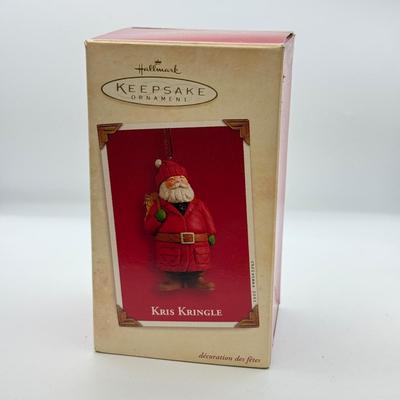 LOT 178: Lenox Fishing Santa, Hallmark Keepsake Ornament Kris Kringle & Trio of Santas all in Boxes